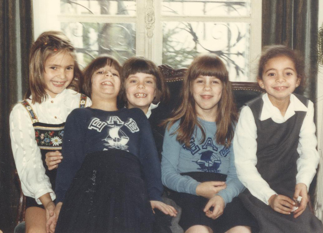 Me (second from right) and my twin sister (second from left) with school friends in Paris, age 7